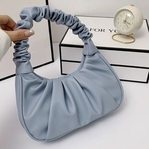 Minimalist top handle ruched bag
